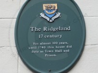 Heritage plaque on the side of the building